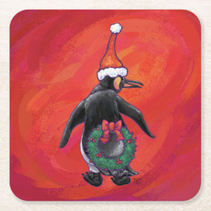 Penguin i Santa Hat på Red Underlägg Papper Kvadrat