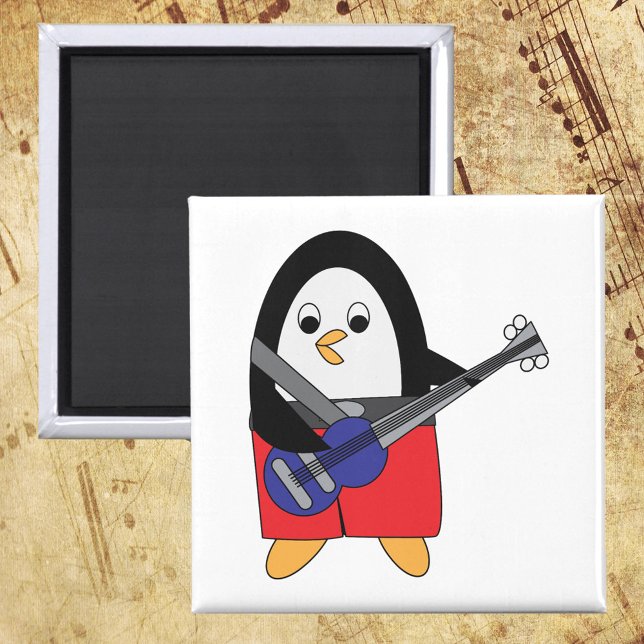 Penguin Spelande Bass Guitar Magnet (A magnet with a cute penguin playing the bass guitar.)