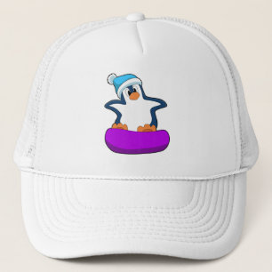 Penguin vid Snowboarding med Snowboard board Keps