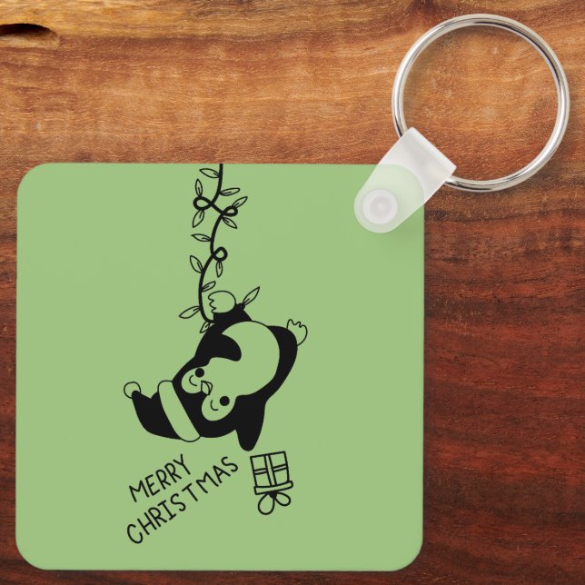 Penguine distributing christmas gifts nyckelring (Baksida)