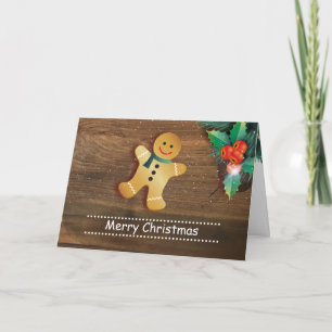 Pepparkaksgubbe och järnek på wood jul helgkort