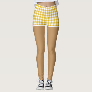 Perfekta ben i moderna gula ginghamshorts leggings