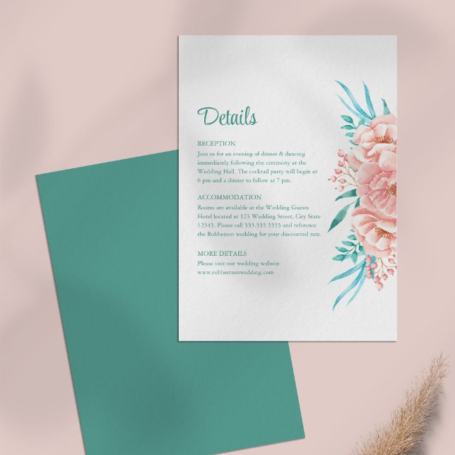 Persika och turkos blomsterbröllop detalj-kort inbjudningar (Peach and Turquoise Floral Wedding Details Card on a pale pink table.)