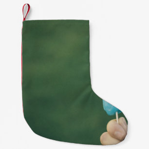 Person som håller is liten julstrumpa