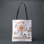 Personalized Funny Soccer Mum Retro Flower  Tygkasse<br><div class="desc">Bring big flower energy to the sidelines with this personalized retro soccer design, perfect for the mum who's here for the vibes (and maybe the snacks). Featuring a groovy flower character, soft daisy accents, and space to customize with your child’s name and “EST.” year, this design is ideal for football...</div>