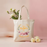 Personalized Happy Mother’s Day Floral Tote Bag Tygkasse<br><div class="desc">Celebrate Mom with this elegant Happy Mother’s Day floral tote bag featuring soft pink blossoms, delicate greenery, and beautiful golden accents arranged in a graceful wreath design. The warm, stylish lettering adds a cheerful and modern touch. Customize this tote with her name, a special message, or meaningful date to create...</div>