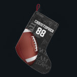 Personlig Chalkboard American Football Liten Julstrumpa<br><div class="desc">Ett modernt amerikanskt fotbollsrutnätsmönster i järn,  med en fotboll på en typografi med en schalkboard-bakgrund med fotbollsterminologi i bakgrunden. Utformningen har anpassade för namn och nummer på fotbollsspelaren eller rutnätet järn fläkt. Denna design har delvis gjorts med grafik som licensierats av Graphics Factory.</div>