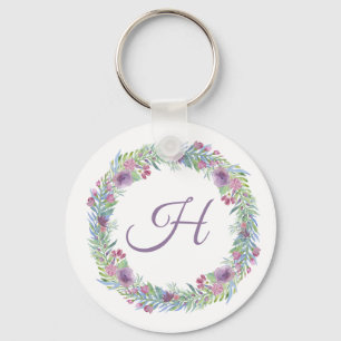Personlig kransmonogram med blommor nyckelring