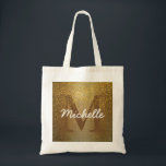 Personlig Monogram Tote Bag, Faux Guld Glitter Tygkasse<br><div class="desc">Rik guld, som är täckt med faux guld glitter, skapar en rik och nästan antika vibrer för den här säcken. Kvinnan är djupt brun för att smälta in i guldglöden. Guld glitter skuggor ovanpå det. Kvinnans namn är på toppen av det i ett lysande, vitt skript. Det här är en...</div>