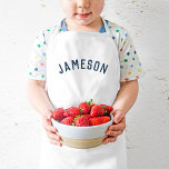 Personlig Namn Monogram | Tunga Barnförkläde<br><div class="desc">De här personligens barnaproner har ditt barns namn i ett modernt, bågformat typsnitt, skapar dem perfekt för unga köksmästare, kreativets klädspel eller som konstnärer som röker kläder när de ritar. De här plattorna är gjorda av ett hållbart och rent väv och tillför en roligt, en personlig beröring, samtidigt som du...</div>