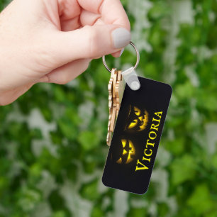 Personligens gult på svartkrämpumpad ansikte nyckelring