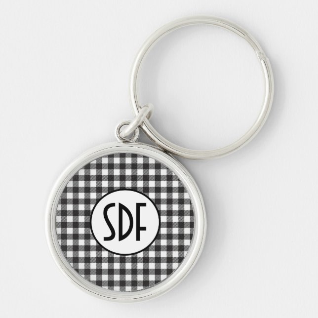 Personligt monogram svart och vitt rutigt rund silverfärgad nyckelring (Framsidan)