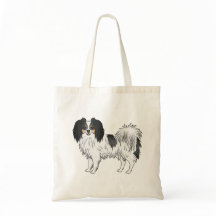 Phalène med trefärgade detaljer Liten fluffig hund