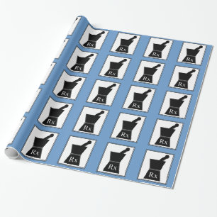 Pharmacistgåva som slår in den pappra pestlen oc presentpapper