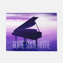 Piano på stranden på dörrmattan för