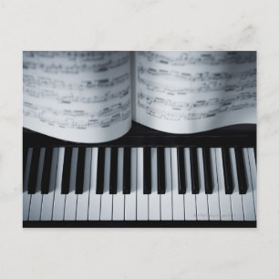 Pianonycklar och musikbok vykort