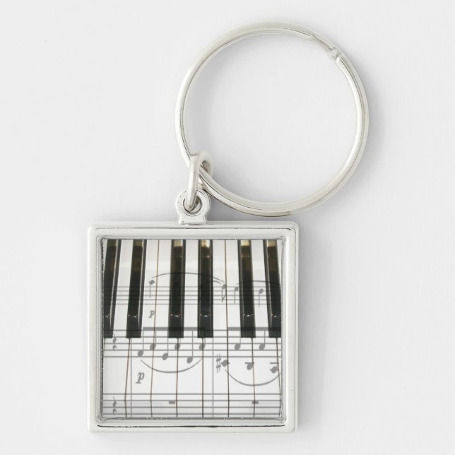 Pianotangentbord och musik noter fyrkantig silverfärgad nyckelring (Framsidan)