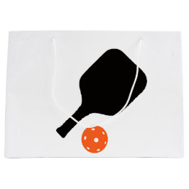 Pickleball paddle och orange pickleball