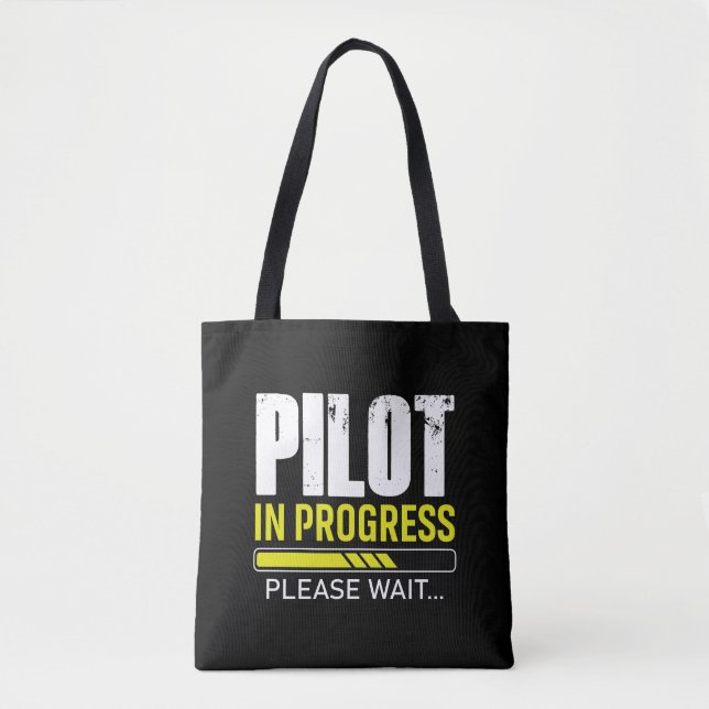Pilot pågår… Vänligen vänta | Pilotpresentidé Tygkasse (Framsida)