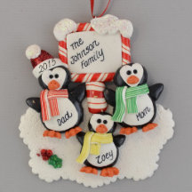 Pingvin (3) med en prydnad för plattaleradeg