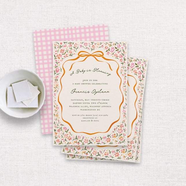 Pink Dainty Flowers and Orange Bow Baby Shower Inbjudningar (pretty watercolor drawn florals and an orange bow and ribbon frame cottage baby shower invitation)