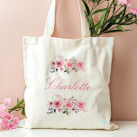 Pink Floral Bridesmaid Name Tygkasse<br><div class="desc">Pink Floral Bridesmaid Name Tote Bag This elegant pink floral watercolor tote bag is a perfect bridesmaid proposal or gift. Featuring a custom name in beautiful calligraphy, it's a stylish and practical accessory for your wedding celebration. Its delicate floral design adds a touch of sophistication, making it a memorable keepsake...</div>