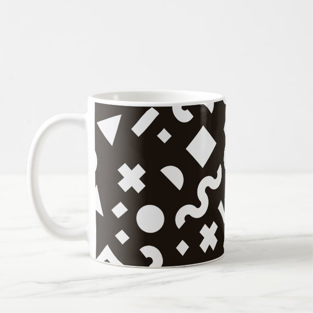 Platt struktur av geometriska färgformer. Monochr Kaffemugg (Vänster)