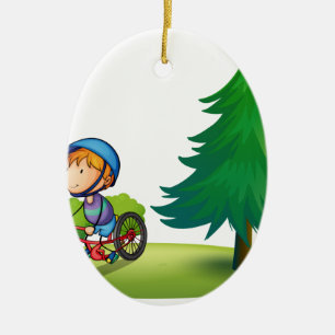 Pojke och cykel julgransprydnad keramik