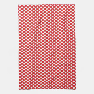 Polka dots på rött kökshandduk