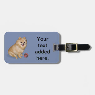 Pomeranian hund med boll bagagebricka