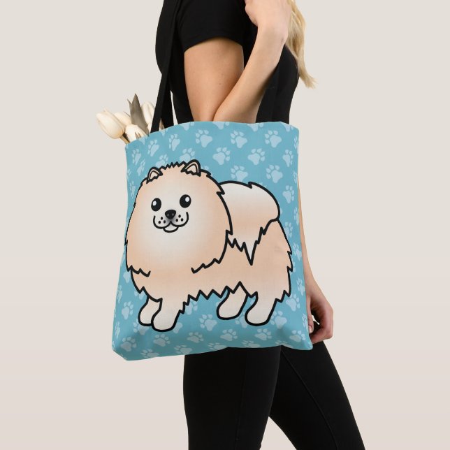 Pomeranian seriefigur hund i krämfärgad päls tygkasse (Närbild)