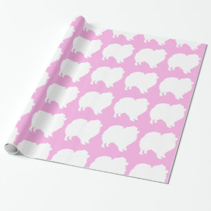 Pomeranian som slår in pappra vitsilhouetterosor presentpapper