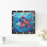 Pop Art Patriotic Fish Fyrkantig Klocka<br><div class="desc">Den här vibrerande väggklockan har en unik popkonfiskfisk från stil, som är djärvt fäst vid det amerikanska flagga stars och stripes mot en dynamisk blå bakgrund med röda stänk. Detta konstnärliga tidsstycke är ett lekfullt men patriotiskt tillskott till varje hemskår och erbjuder ett färgstarkt och modernt påstående biet som firar...</div>