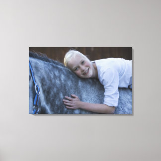 porträtt om en ung flicka på en vit häst canvastryck