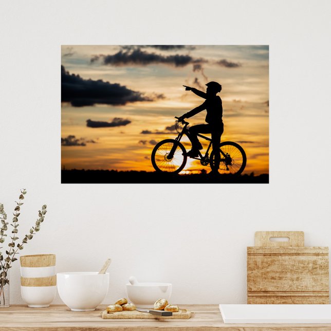 Poster cyklist (Silhouette of a man on a bicycle, wearing a helmet, pointing to the right, sunset background.)