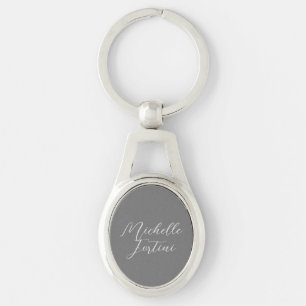 Professionell minimalist modern handstil namn ovalt silverfärgad nyckelring