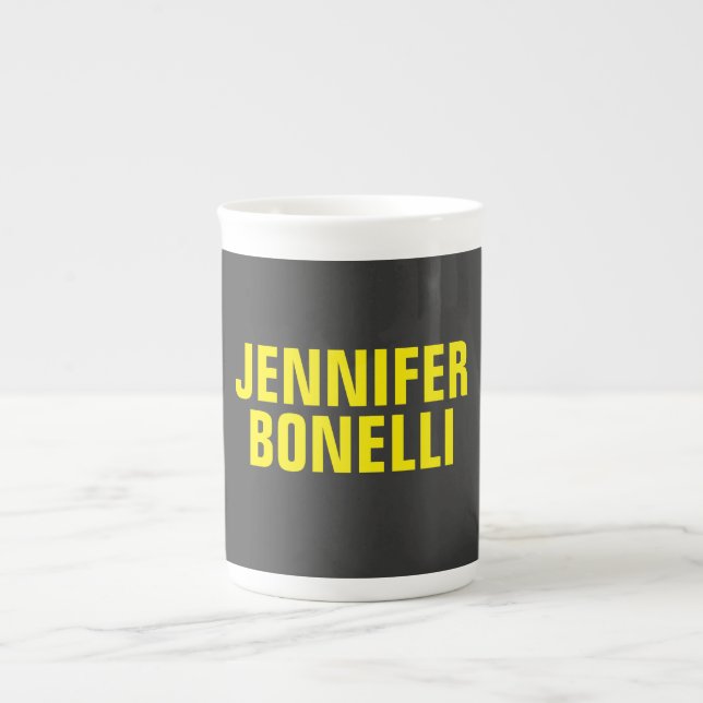 Professionell minimalistisk modern svart gult benporslin mugg (Framsidan)