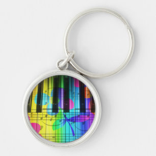 Psychedelic elektriska pianotangentbord och rund silverfärgad nyckelring