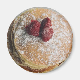 Pudrade pannkakor sockrar och hallonmagneten magnet