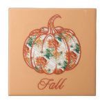 Pumpkin in a Chrysanthemum Pattern Kakelplatta<br><div class="desc">Ceramic tile in a design! featuring a pumpkin outline filled with a rich floral chrysanthemum pattern in warm orange and green hues,  it captures the essence of autumn.</div>