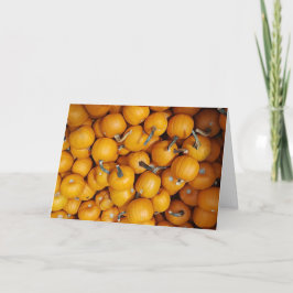 Pumpkins för höstblommor i happy halloween kort