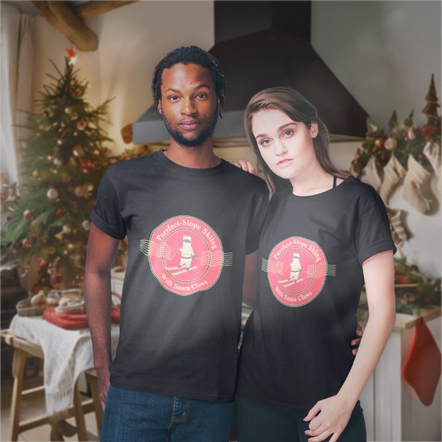 Purrfect-Slope Skiing med Santa Klo T-Shirt (A couple wears the Purrfect-Slope Skiing with Santa Claws T-Shirt in the kitchen. )