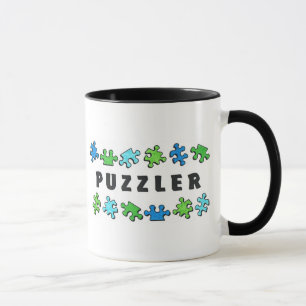 Puzzleren med pussel lappar mugg