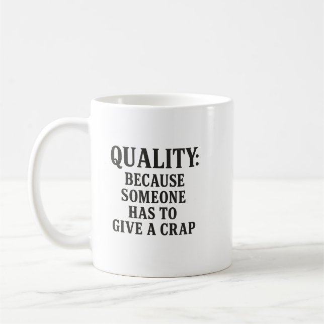 Quality: Because Someone has to... Kaffemugg (Vänster)
