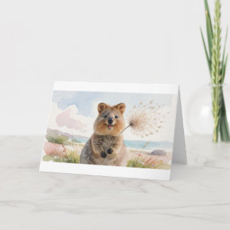 Quokka som blåser ett luddigt frö huvud i vinden kort