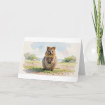 Quokka som mumsar på sött gräs i den soliga glänta
