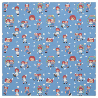 Raggedy Ann och Andy på fallande hjärtan på blått Tyg