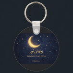 Ramadan Moon Islamic Art – Ramadan Is a Light With Nyckelring<br><div class="desc">Celebrate the beauty and spiritual glow of Ramadan with this elegant crescent moon artwork. Featuring a luminous golden crescent surrounded by stars on a deep midnight-blue background, this design symbolizes the light, reflection, and serenity of the holy month. The Arabic calligraphy “Ramadan Nur” is paired with the inspiring message “Ramadan...</div>