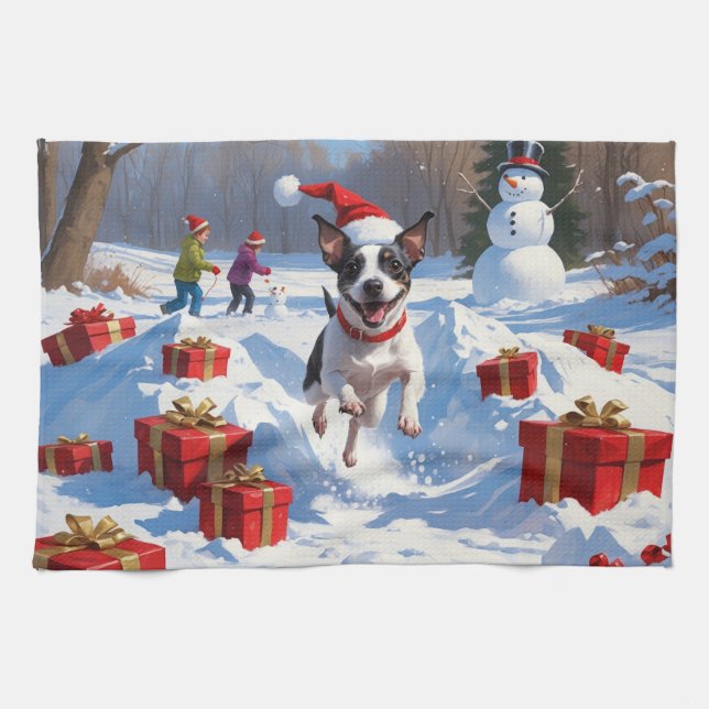 Råttterrier springer i snö med julhatt kökshandduk (Horisontell)