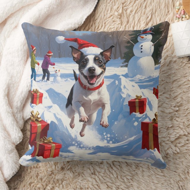 Råttterrier springer i snö med julhatt kudde (Filt)